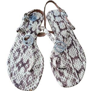 Coach Jazmin PTE thong sandals in natural snakeskin embossed leather.